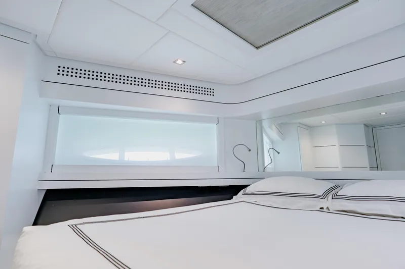 Slide: The Image of Luxurious bedroom interior of 2010 Pershing 80 yacht with modern design and elegant bedding. - 48