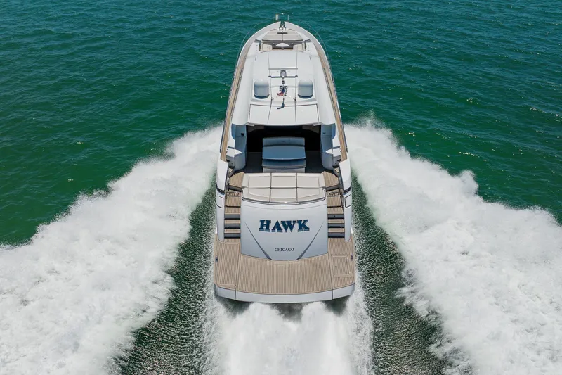 Slide: The Image of 2010 Pershing 80 yacht cruising on open water, rear view. - 5