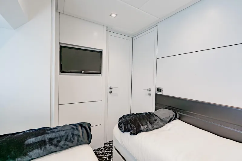 Slide: The Image of Luxurious interior cabin of 2010 Pershing 80 yacht with modern design and twin beds. - 52