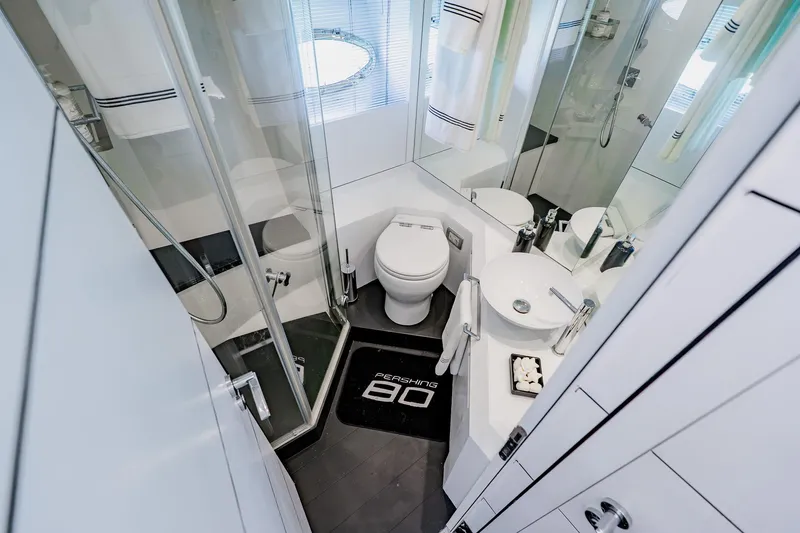 Slide: The Image of Luxurious bathroom interior of a 2010 Pershing 80 yacht, featuring modern fixtures and elegant design. - 53