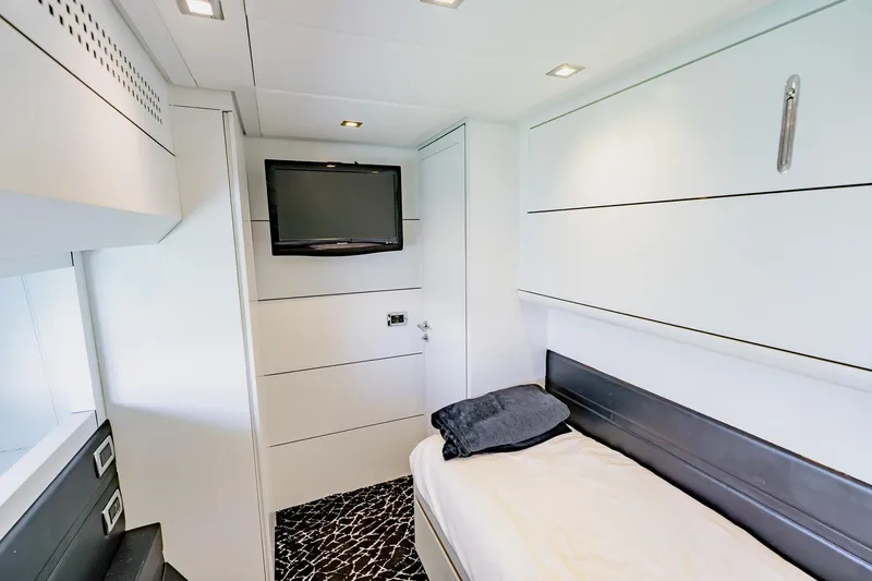 Slide: The Image of Modern cabin interior of 2010 Pershing 80 yacht with sleek design and wall-mounted TV. - 58