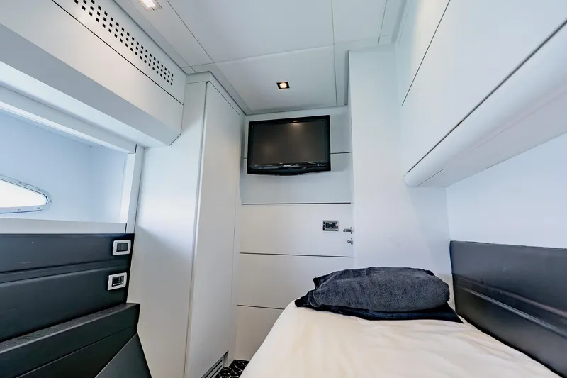 Slide: The Image of Luxurious cabin interior of a 2010 Pershing 80 yacht with modern amenities. - 59