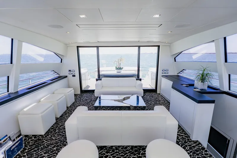 Slide: The Image of Luxurious interior of 2010 Pershing 80 yacht with modern white seating and ocean view. - 61