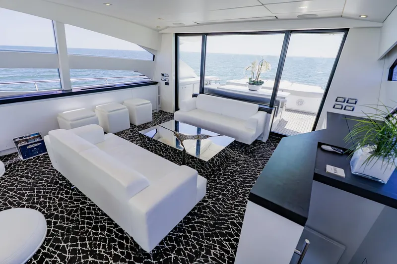 Slide: The Image of Luxurious interior of 2010 Pershing 80 yacht with modern white seating and ocean view. - 62