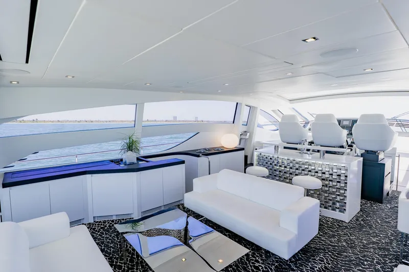 Slide: The Image of Luxurious interior of a 2010 Pershing 80 yacht with modern seating and panoramic windows. - 64