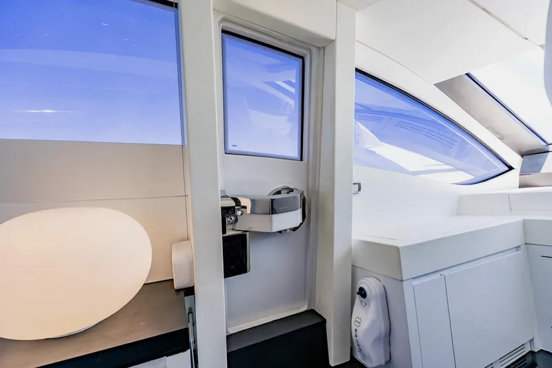 Slide: The Image of Interior of 2010 Pershing 80 yacht, featuring sleek modern design and large windows. - 68