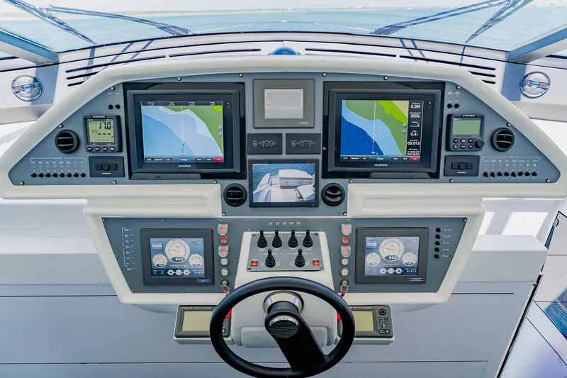 Slide: The Image of Cockpit of 2010 Pershing 80 yacht with advanced navigation and control systems. - 72