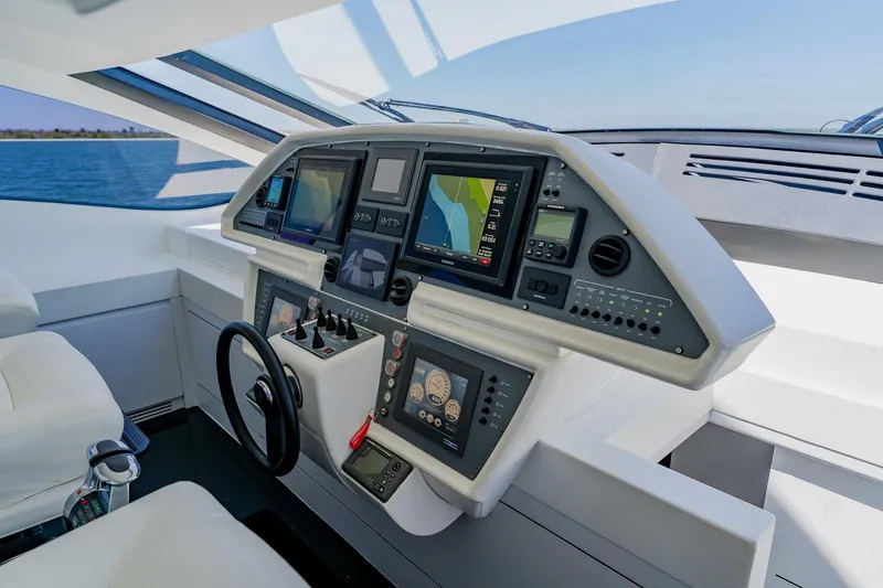 Slide: The Image of Cockpit of 2010 Pershing 80 yacht with advanced navigation and control systems. - 74
