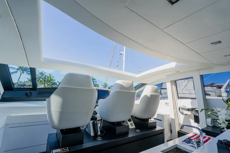 Slide: The Image of Luxurious interior of a 2010 Pershing 80 yacht with modern helm and seating. - 75