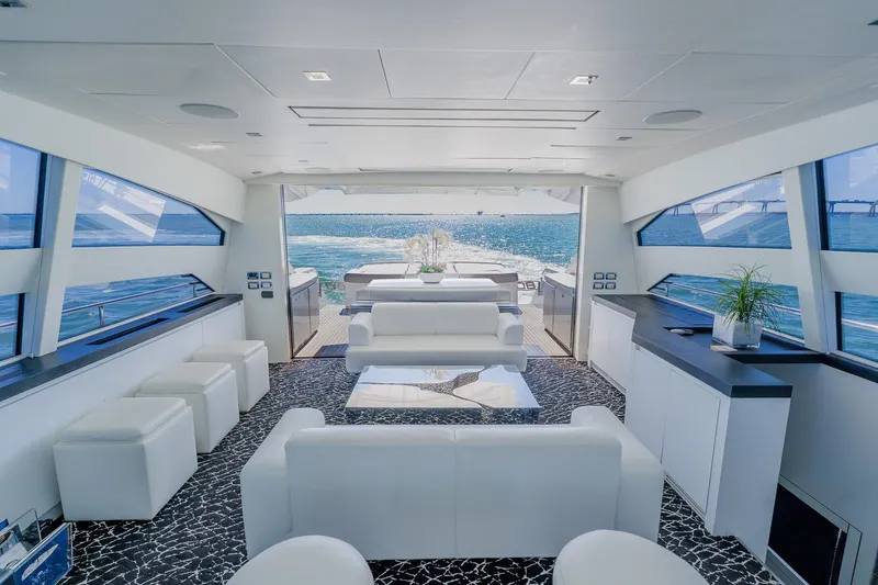Slide: The Image of Luxurious interior of 2010 Pershing 80 yacht with ocean view and modern white furnishings. - 79