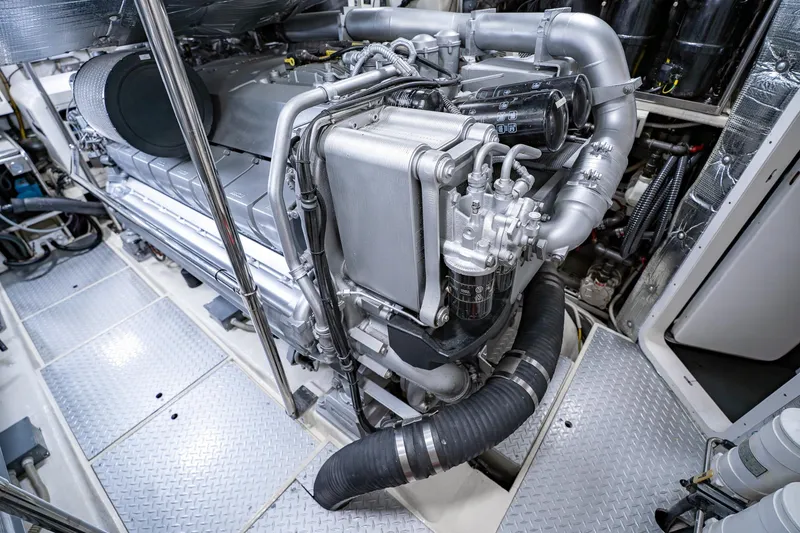 Slide: The Image of Engine room of a 2010 Pershing 80 yacht, showcasing advanced machinery and components. - 96