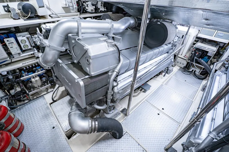 Slide: The Image of Engine room of a 2010 Pershing 80 yacht, showcasing advanced machinery and equipment. - 97