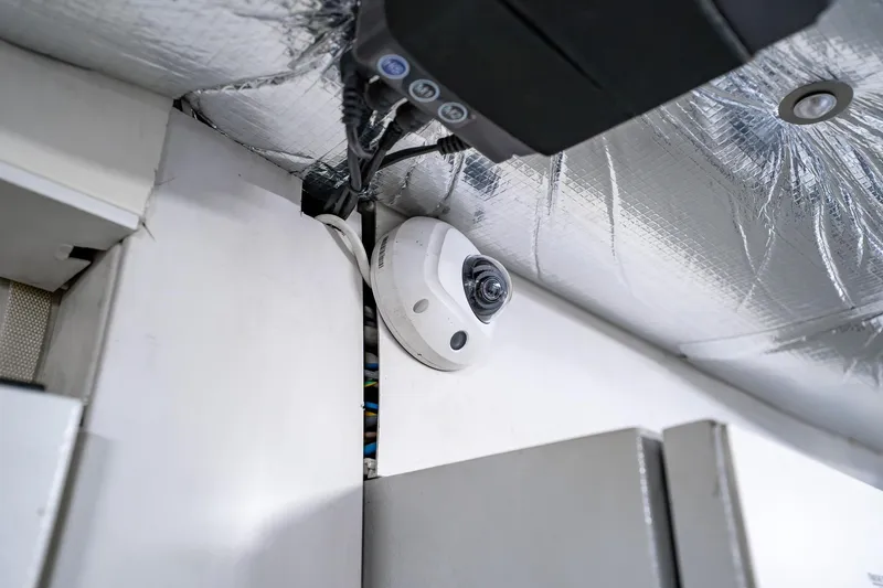 Slide: The Image of Security camera installed on a 2010 Pershing 80 yacht ceiling. - 99