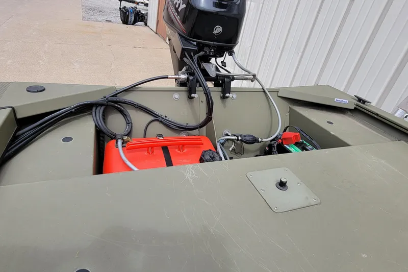 Slide: The Image of 2017 Tracker Grizzly 1648 SC boat with Mercury outboard motor and fuel tank. - 13