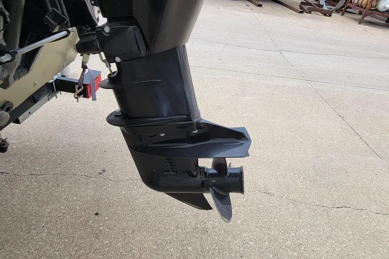 Slide: The Image of 2017 Tracker Grizzly 1648 SC boat motor and propeller detail on concrete surface. - 4