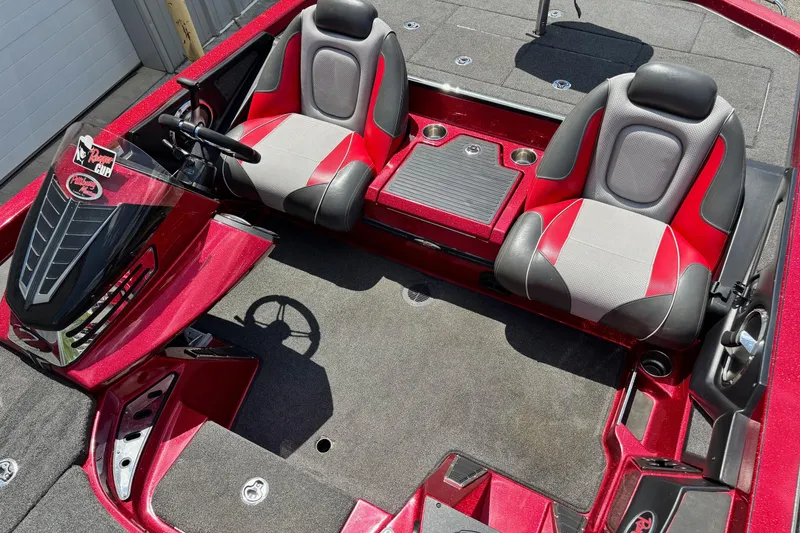Slide: The Image of 2021 Ranger Z520C Cup-Equipped boat interior with red and gray seating. - 11
