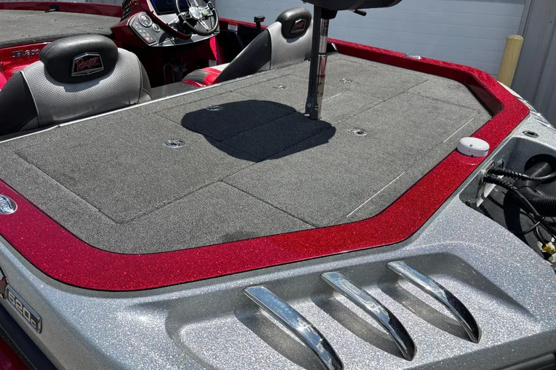 Slide: The Image of 2021 Ranger Z520C Cup-Equipped boat interior with red accents and seating. - 15
