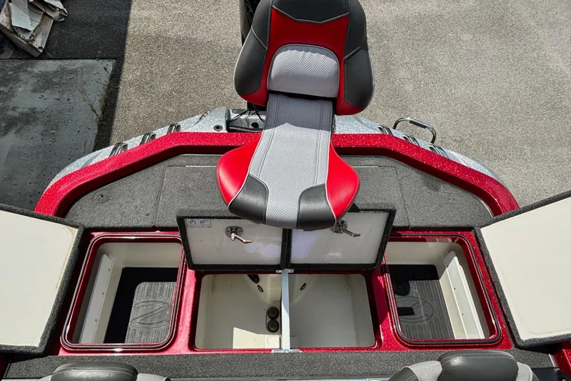 Slide: The Image of 2021 Ranger Z520C Cup-Equipped boat interior with red and gray seating and storage compartments. - 16