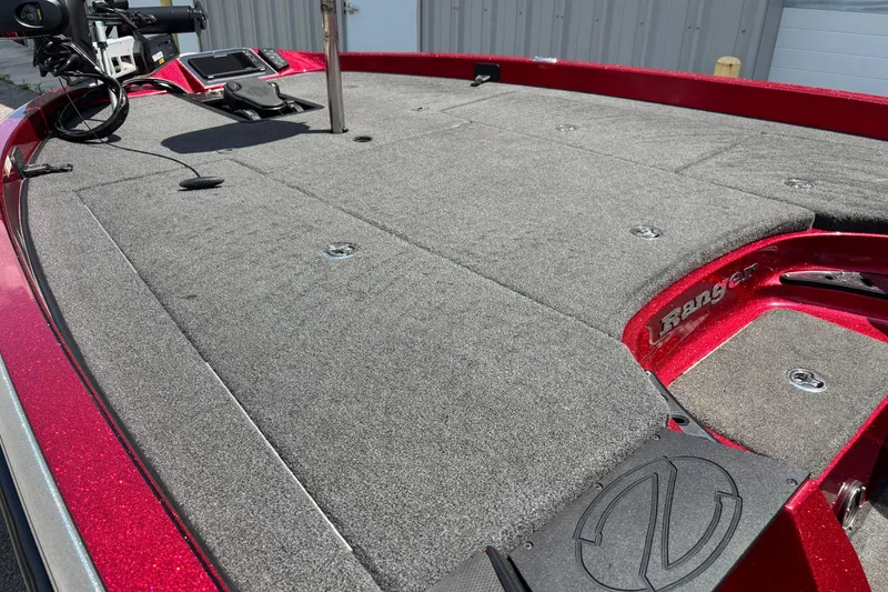 Slide: The Image of 2021 Ranger Z520C Cup-Equipped boat deck with gray carpet and red accents. - 8