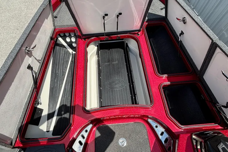 Slide: The Image of 2021 Ranger Z520C Cup-Equipped boat storage compartments, open and spacious, with red accents. - 9