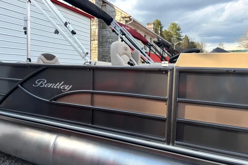 The Image of 2026 Bentley Pontoons Fish 220 N-Cruise pontoon boat, side view with logo and seating. - 0