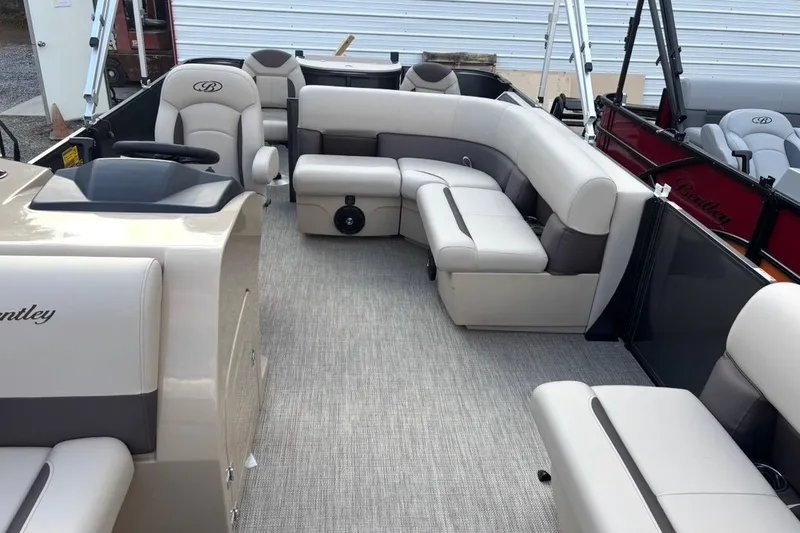 Slide: The Image of 2026 Bentley Pontoons Fish 220 N-Cruise interior with beige seating and modern design. - 10