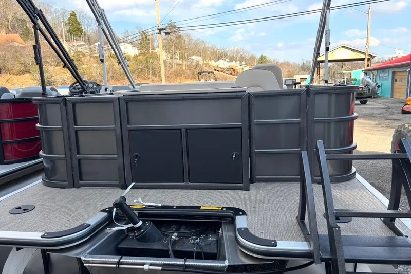 Slide: The Image of 2026 Bentley Pontoons Fish 220 N-Cruise pontoon boat with spacious deck and storage compartments. - 3
