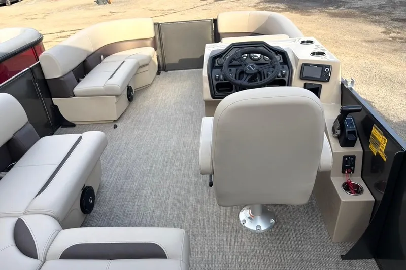 Slide: The Image of 2026 Bentley Pontoons Fish 220 N-Cruise interior with beige seating and modern helm. - 7
