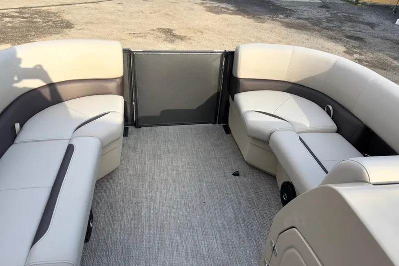 Slide: The Image of 2026 Bentley Pontoons Fish 220 N-Cruise interior with beige seating and carpeted floor. - 9