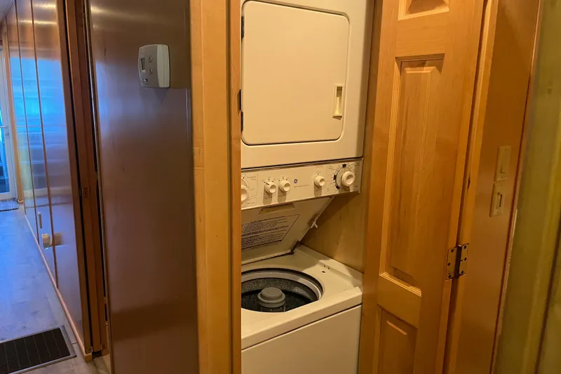 Slide: The Image of Stacked washer and dryer in a wooden closet, Majestic Legacy 2005 model. - 23