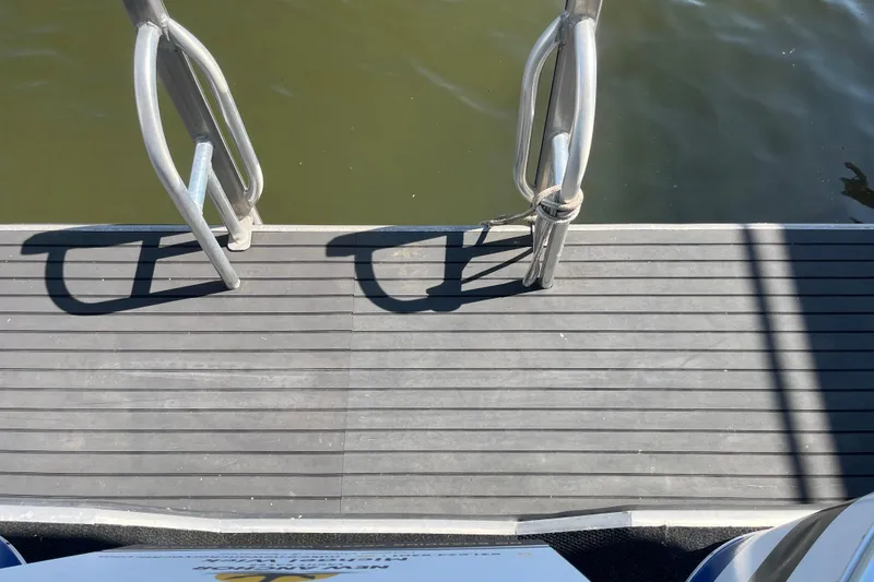 Slide: The Image of Boat deck with metal railings, Majestic Legacy 2005, overlooking calm water. - 34