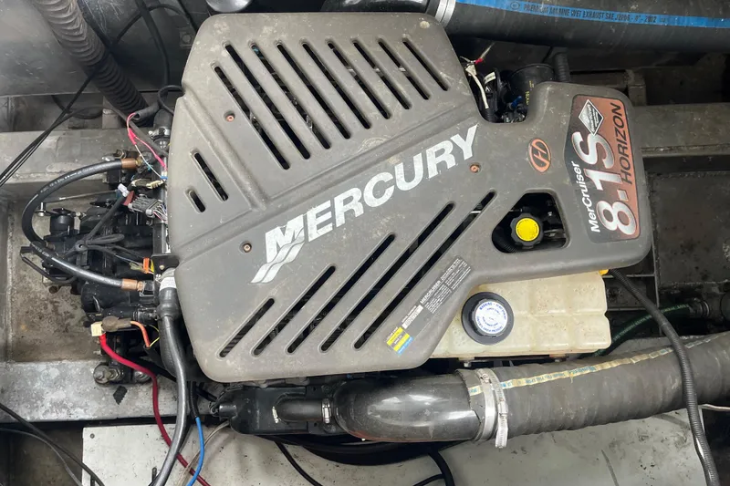 Slide: The Image of ```json { "alt_text": "Mercury MerCruiser 8.1S engine in a 2005 Majestic Legacy boat." } ``` - 49