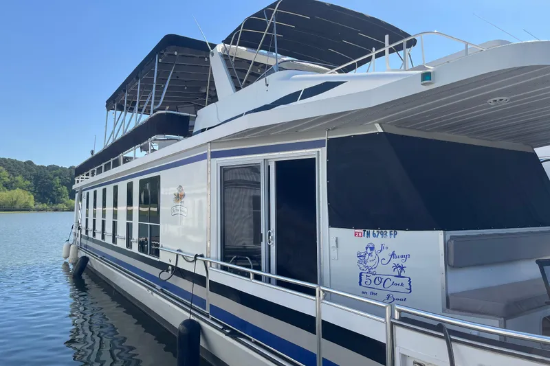 Slide: The Image of Houseboat docked on a sunny day, Majestic Legacy 2005 model. - 5