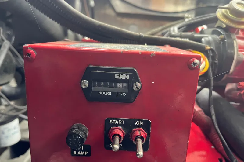 Slide: The Image of Red engine hour meter with switches in a 2005 Majestic Legacy vehicle. - 51