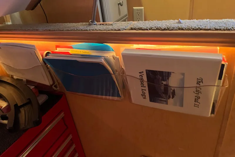 Slide: The Image of Organized files and vessel logs in a 2005 Majestic Legacy boat interior. - 52