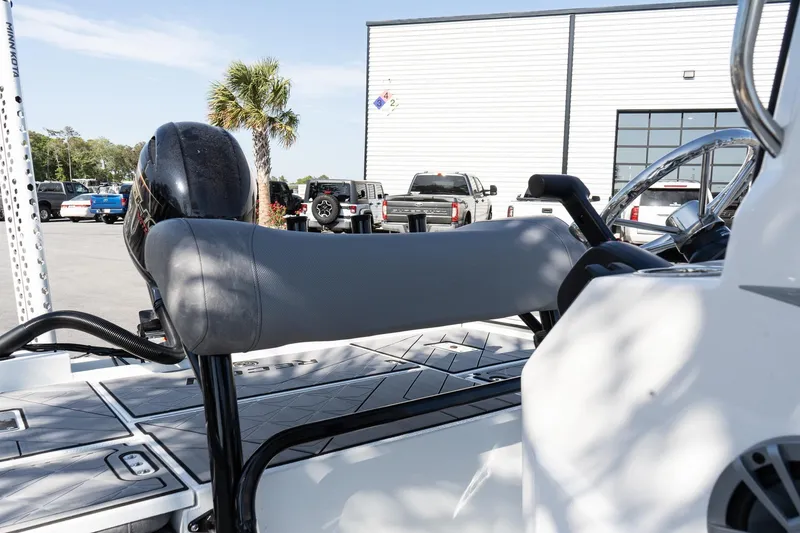 Slide: The Image of Avid 207 Recon 2026 boat with sleek seating and modern design in a sunny outdoor setting. - 10