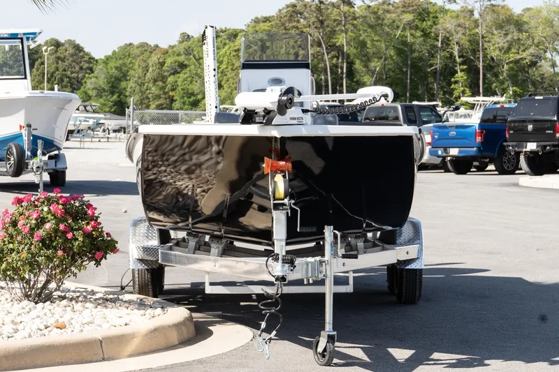 Slide: The Image of Avid 207 Recon 2026 boat on trailer in sunny marina setting. - 3