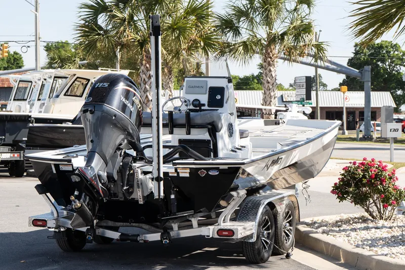 Slide: The Image of Avid 207 Recon 2026 boat on trailer with Yamaha engine, parked outdoors. - 6