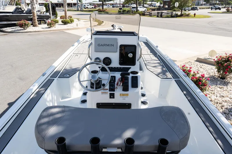 Slide: The Image of Avid 207 Recon 2026 boat interior with Garmin navigation system and steering wheel. - 7