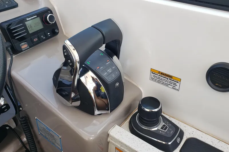 Slide: The Image of Control panel of a 2019 Rinker EX 370 boat with navigation equipment. - 29