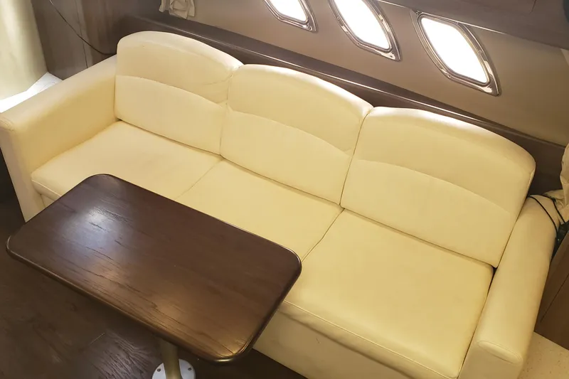 Slide: The Image of Luxurious interior of 2019 Rinker EX 370 yacht with cream sofa and wooden table. - 35