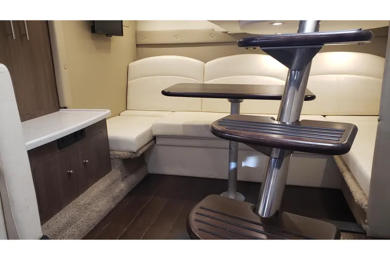 Slide: The Image of 2019 Rinker EX 370 interior with modern seating and wooden steps. - 39