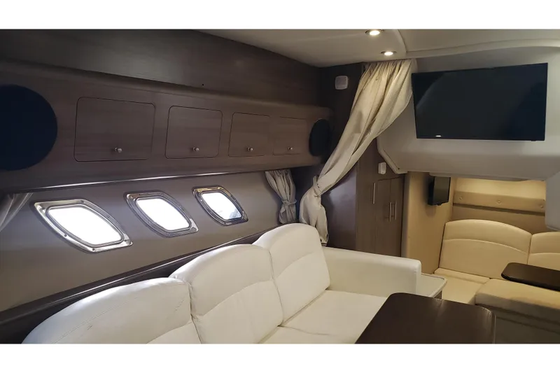 Slide: The Image of Luxurious interior of 2019 Rinker EX 370 yacht with elegant seating and modern amenities. - 45