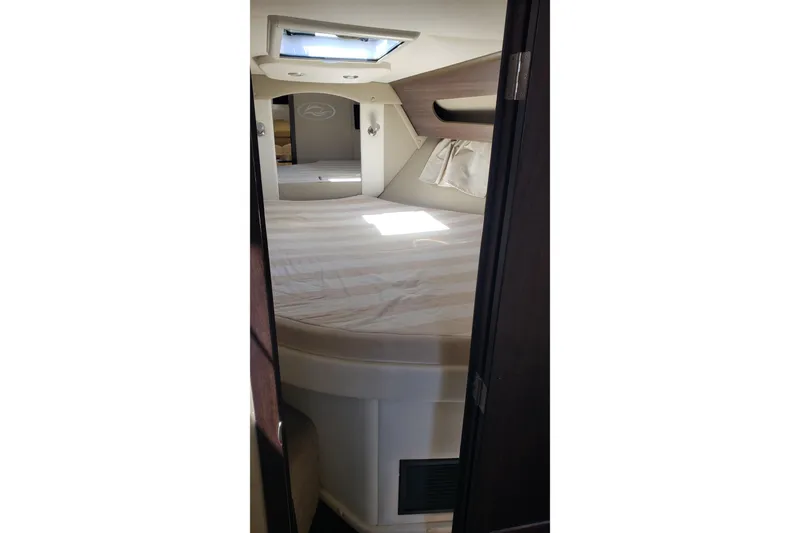 Slide: The Image of Interior cabin of 2019 Rinker EX 370 boat with bed and skylight. - 51