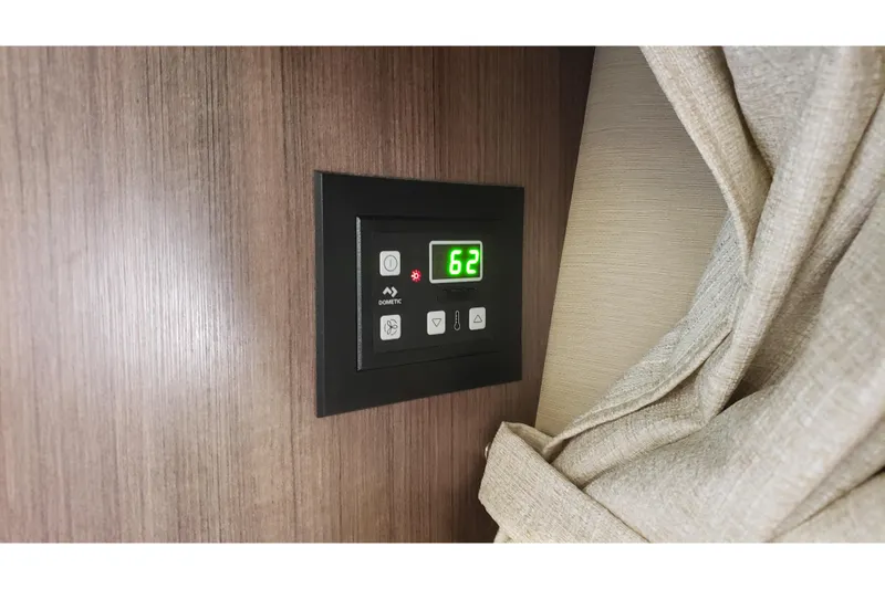 Slide: The Image of Digital control panel on 2019 Rinker EX 370 boat, displaying temperature setting. - 58