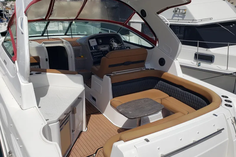 Slide: The Image of 2019 Rinker EX 370 boat interior with luxurious seating and modern dashboard. - 6