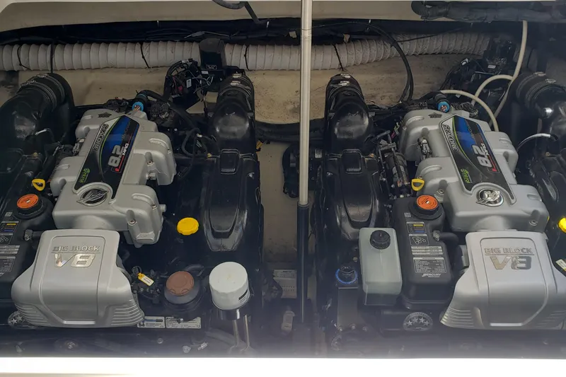 Slide: The Image of Twin V8 engines in a 2019 Rinker EX 370 boat engine compartment. - 60