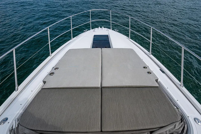 Slide: The Image of 2019 Azimut Atlantis 51 yacht deck with sunbathing area on open water. - 10