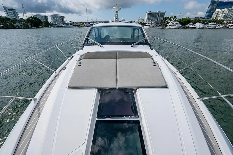Slide: The Image of 2019 Azimut Atlantis 51 yacht with spacious deck, docked in a marina. - 11
