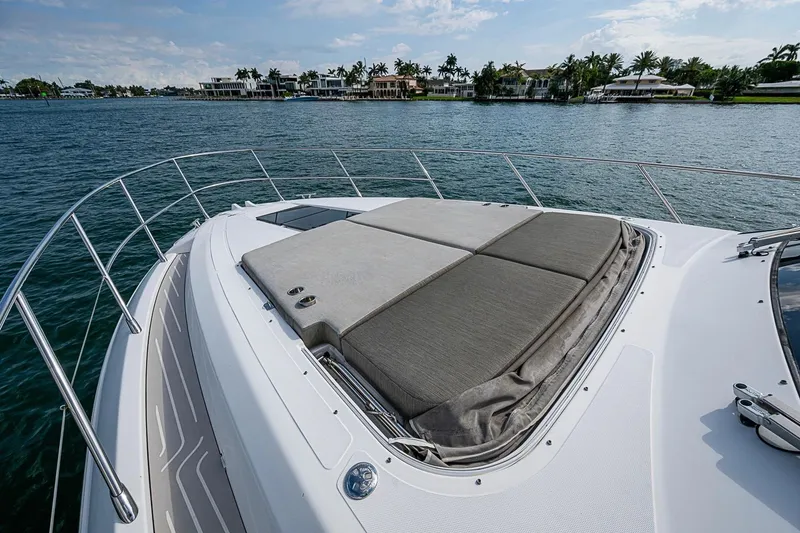 Slide: The Image of Luxurious 2019 Azimut Atlantis 51 yacht with spacious sunbathing deck on calm waters. - 12